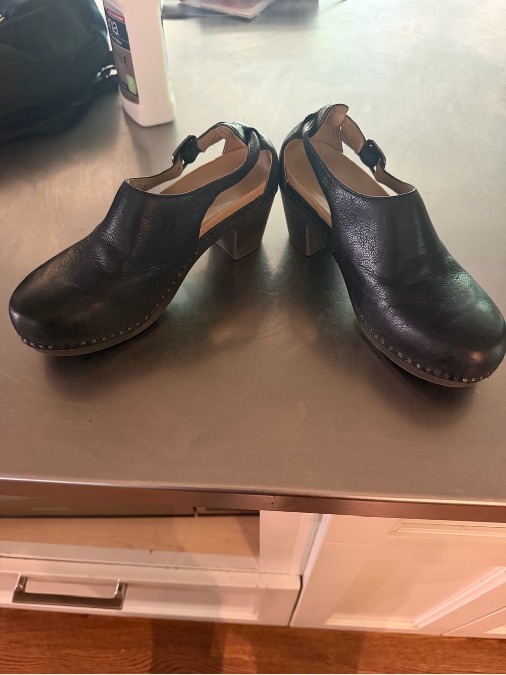 Dansko Black Leather Slingback Clogs with Studded Trim
